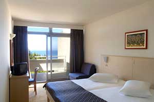 Superior twin with sea view, balcony, private facilities (bath), and half board